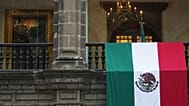 A Mexican flag hangs at the National Palace as President Claudia Sheinbaum delivers her first state-of-the-nation address in Mexico City. 1 Sept. 2025.