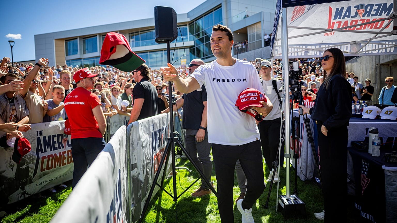 FILE: Charlie Kirk hands out hats before speaking at Utah Valley University in Orem, Utah, 10 September 2025