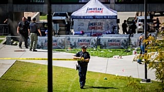 FILE: Law enforcement tapes off an area after Charlie Kirk was shot at Utah Valley University, in Orem, UT, 10 September 2025