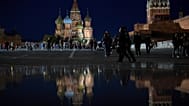 People enjoy a warm evening walking on Red Square in Moscow, Russia
