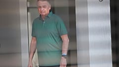 Brazil's former President Jair Bolsonaro stands at the entrance of his home where he is under house arrest in Brasilia, Brazil, Thursday, Sept. 11, 2025. (AP Photo/Luis Nova)