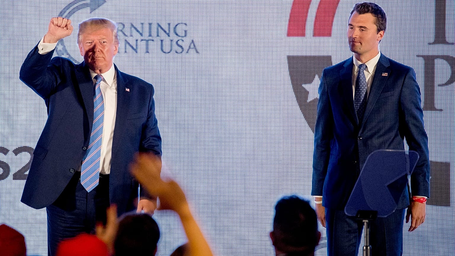 FILE: US President Donald Trump is joined on stage with Turning Point USA Founder Charlie Kirk as he finishes speaking at a summit in Washington, 23 July 2019
