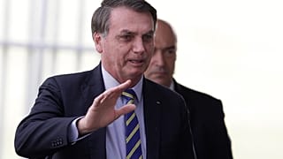 Brazil's President Jair Bolsonaro waves to supporters