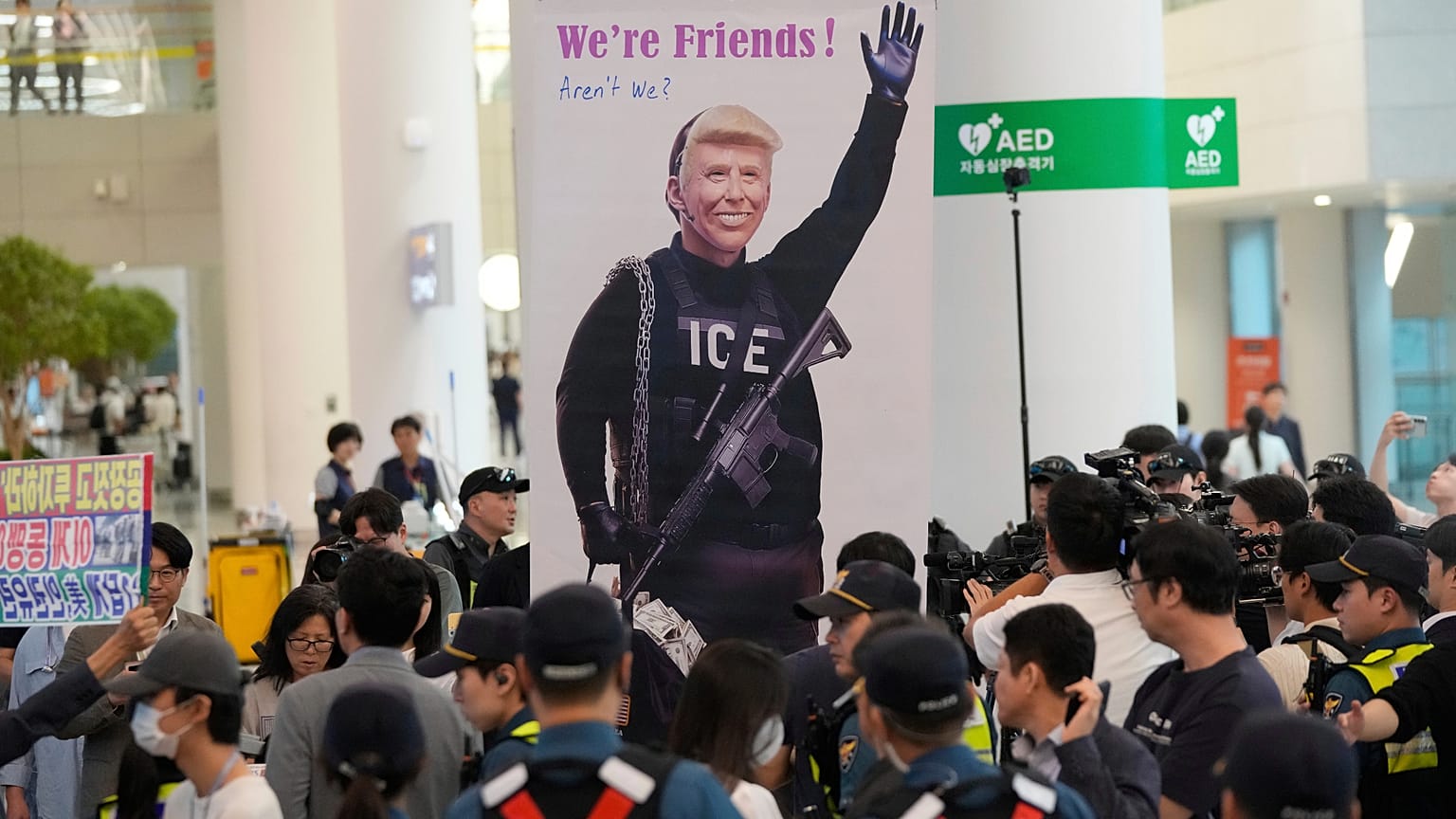 A banner depicting U.S. President Donald Trump is seen at the arrival terminal of the Incheon International Airport, in Incheon, South Korea, Friday, Sept. 12, 2025.