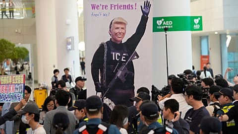 A banner depicting U.S. President Donald Trump is seen at the arrival terminal of the Incheon International Airport, in Incheon, South Korea, Friday, Sept. 12, 2025.