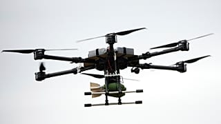 A drone carrying a bomb flies over during joint Russian-Belarusian military drills at a training ground near Barysaw, Belarus, 15 September 2025.