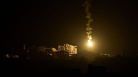 An Israeli army flare drifts over buildings during the Israeli ground and air operations in the northern Gaza Strip, as seen from southern Israel, Monday, Sept. 15, 2025.