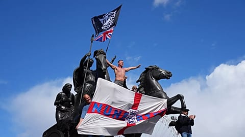 People demonstrate during the Tommy Robinson-led Unite the Kingdom march and rally in London, 13 September, 2025