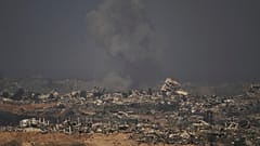 Smoke rises to the sky following an Israeli military strike in the northern Gaza Strip, as seen from southern Israel, Tuesday, Sept. 16, 2025.