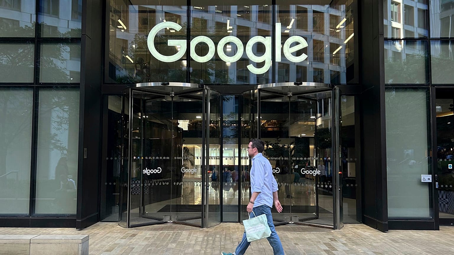 FILE - A man walks past Google's offices in London's Kings Cross area, on 10 August 2024.