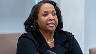 FILE - Federal Reserve Board of Governors member Lisa Cook listens during an open meeting of the Board of Governors at the Federal Reserve. 25 June 2025.