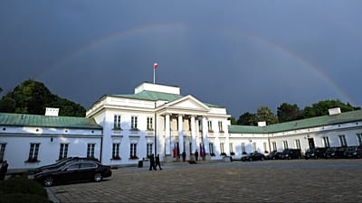 FILE: A rainbow rises above the Belweder Palace in Warsaw, Poland, Monday, May 30, 2016.