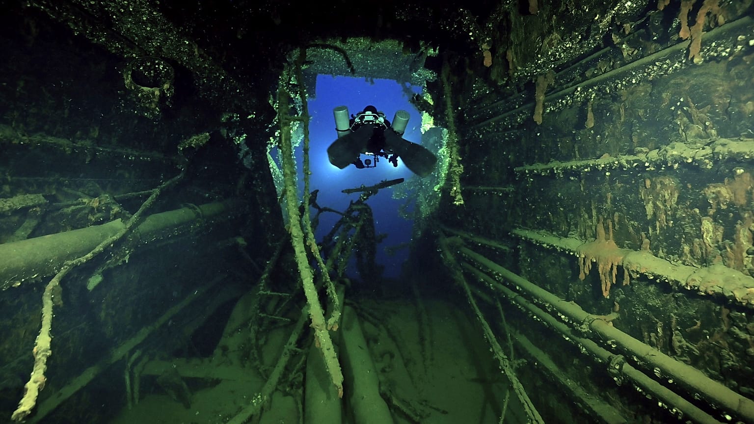 Divers illuminate the wreck's interior of the Britannic, sister ship to the Titanic, for the first time since the ocean liner sank in the Aegean Sea