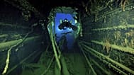 Divers illuminate the wreck's interior of the Britannic, sister ship to the Titanic, for the first time since the ocean liner sank in the Aegean Sea