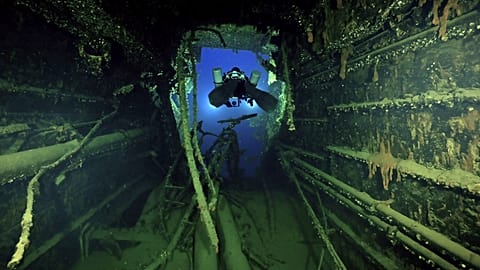 Divers illuminate the wreck's interior of the Britannic, sister ship to the Titanic, for the first time since the ocean liner sank in the Aegean Sea