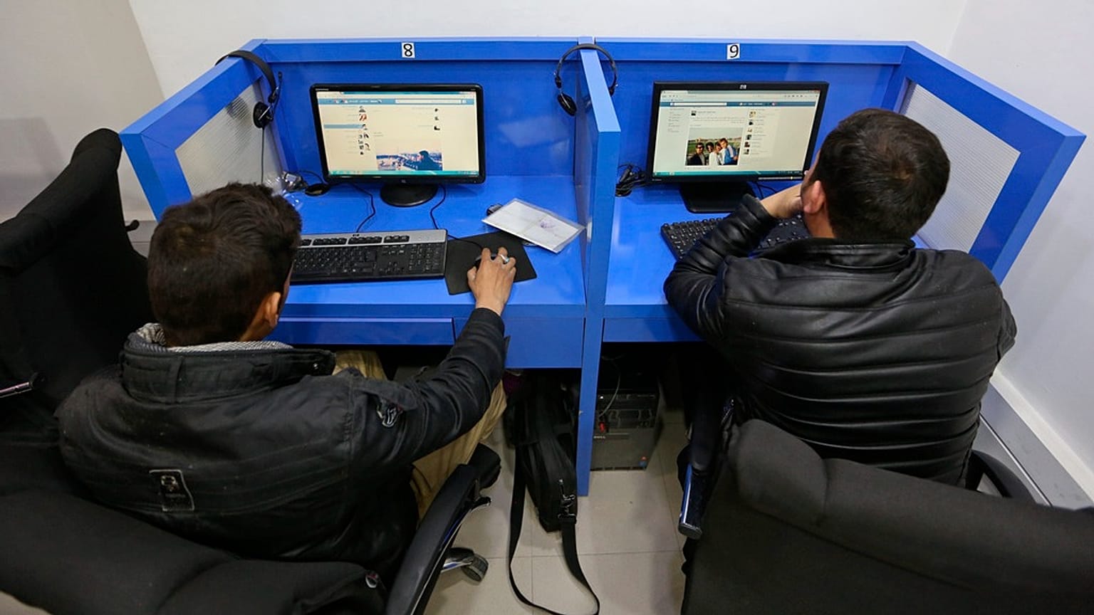 FILE: Afghanis access social media websites at a private internet cafe in Kabul, Afghanistan, Feb. 10, 2016.