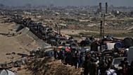 Displaced Palestinians flee northern Gaza along the coastal road toward the south, 16 September, 2025 