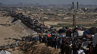 Displaced Palestinians flee northern Gaza along the coastal road toward the south, 16 September, 2025 