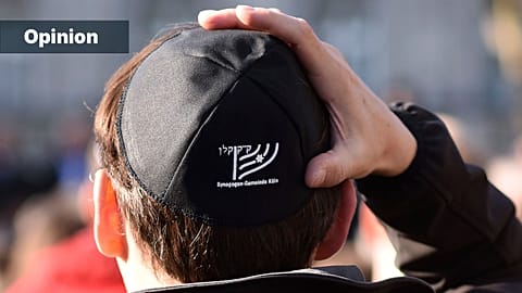 A man wears a Jewish kippa as he attends a demonstration against anti-Semitism in Cologne, April 2018