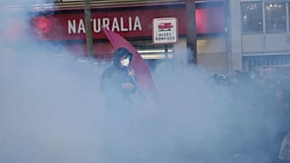 A protester stands in tear gas smoke during a demonstration in Paris, 18 September, 2025