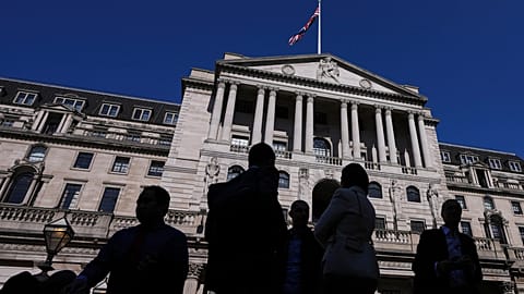 People are silhouetted as they pass The Bank of England in London, Thursday, 3 April 2025.