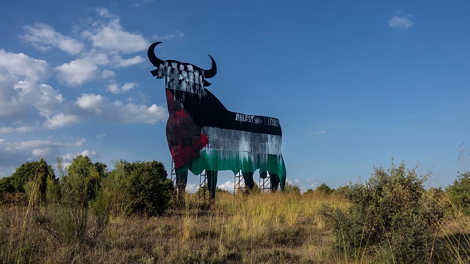 A Spanish fighting bull billboard painted with the colours of the Palestinian flag on the outskirts of Madrid, 28 May, 2024