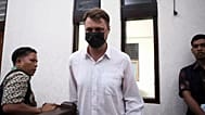 Ukrainian citizen Roman Nazarenko arrives for a hearing at the district court in Denpasar, 18 September, 2025