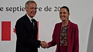 Canada's Prime Minister Mark Carney, left, and Mexico's President Claudia Sheinbaum shake hands after a joint press conference at the National Palace in Mexico City, Thursday,