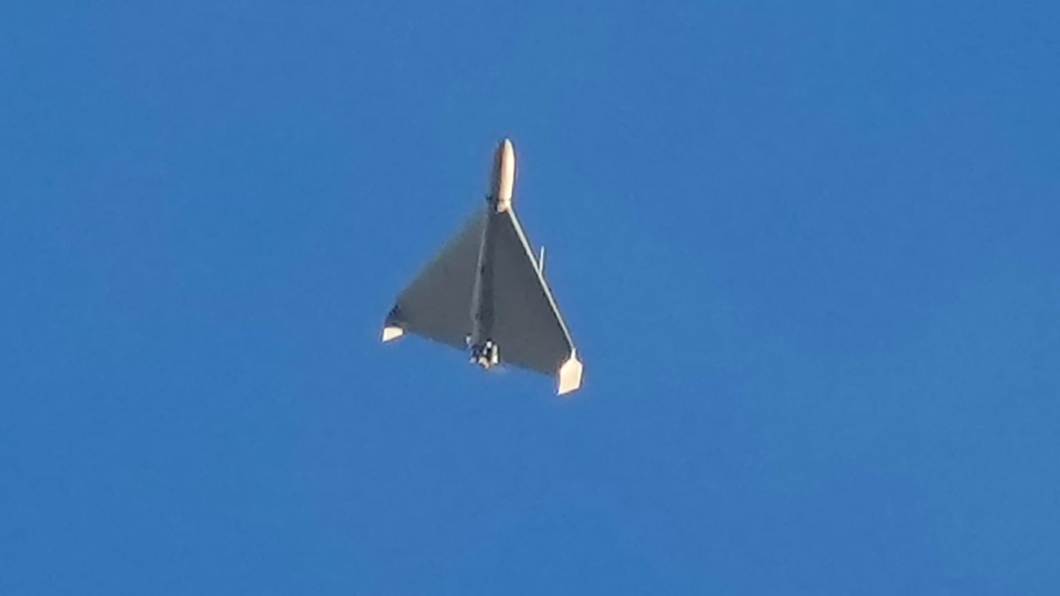 FILE: An Iranian Shahed exploding drone launched by Russia flies through the sky seconds before it strikes buildings in Kyiv, 17 October 2024