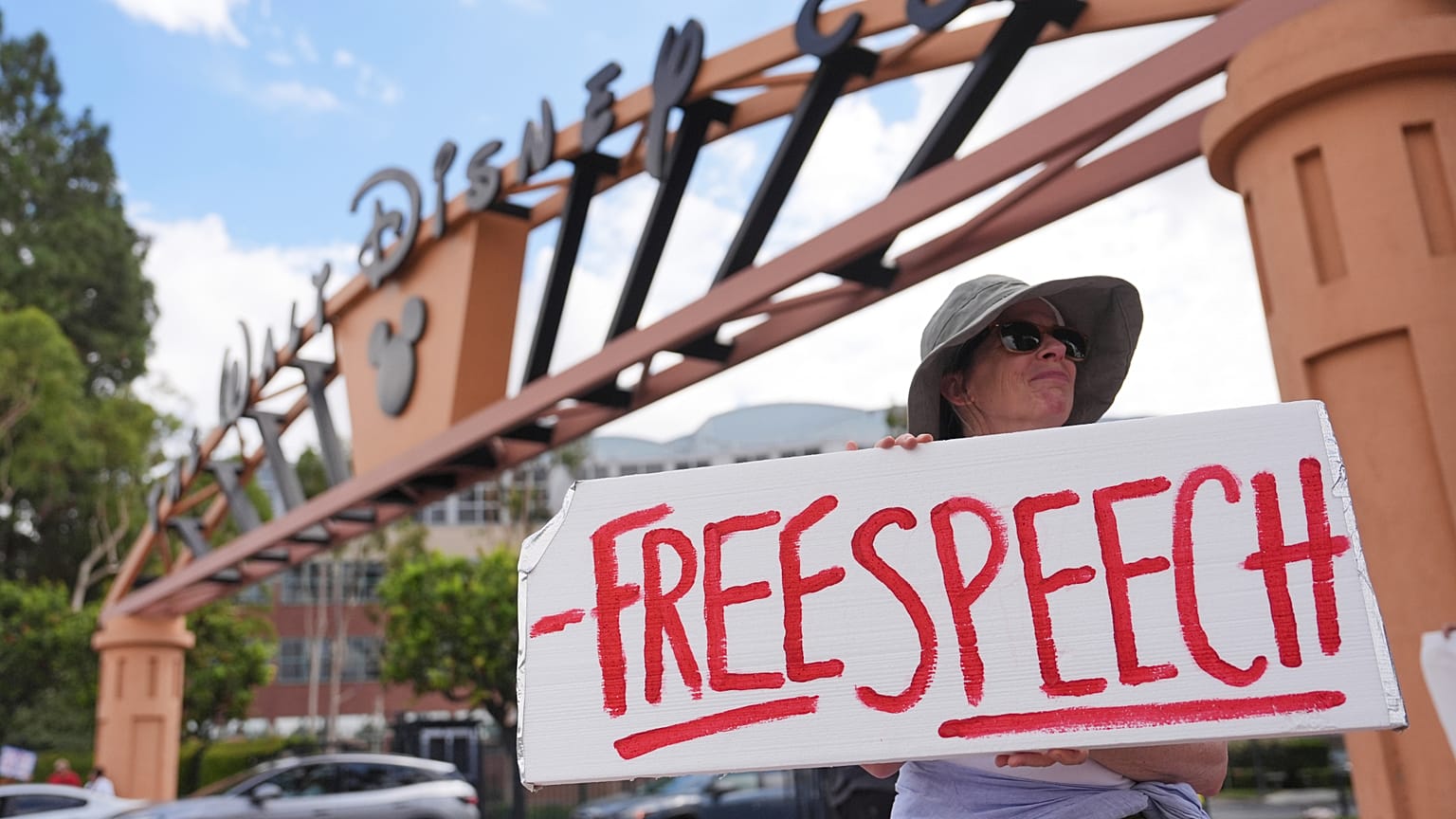 A demonstrator holds a sign in response to the suspension of Jimmy Kimmel's late-night show