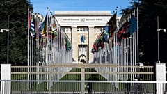 Flags hang in front of the European headquarters of the United Nations in Geneva, Switzerland.