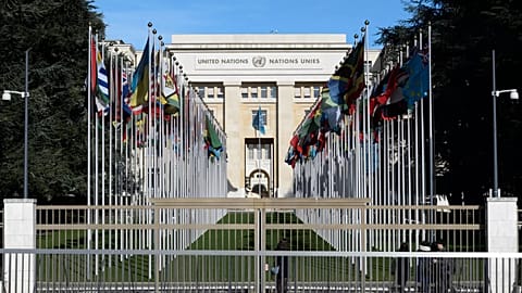 Flags hang in front of the European headquarters of the United Nations in Geneva, Switzerland.