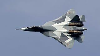 FILE - A new Russian twin-engine jet fighter T-50 flies over Zhukovsky airfield as it takes part in MAKS-2011,