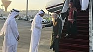 A Qatari official welcomes the released British couple, Barbie and Peter Reynolds, as they step off the plane upon their arrival in Doha, Qatar, Friday, Sept. 19, 2025.