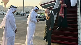 A Qatari official welcomes the released British couple, Barbie and Peter Reynolds, as they step off the plane upon their arrival in Doha, Qatar, Friday, Sept. 19, 2025. 
