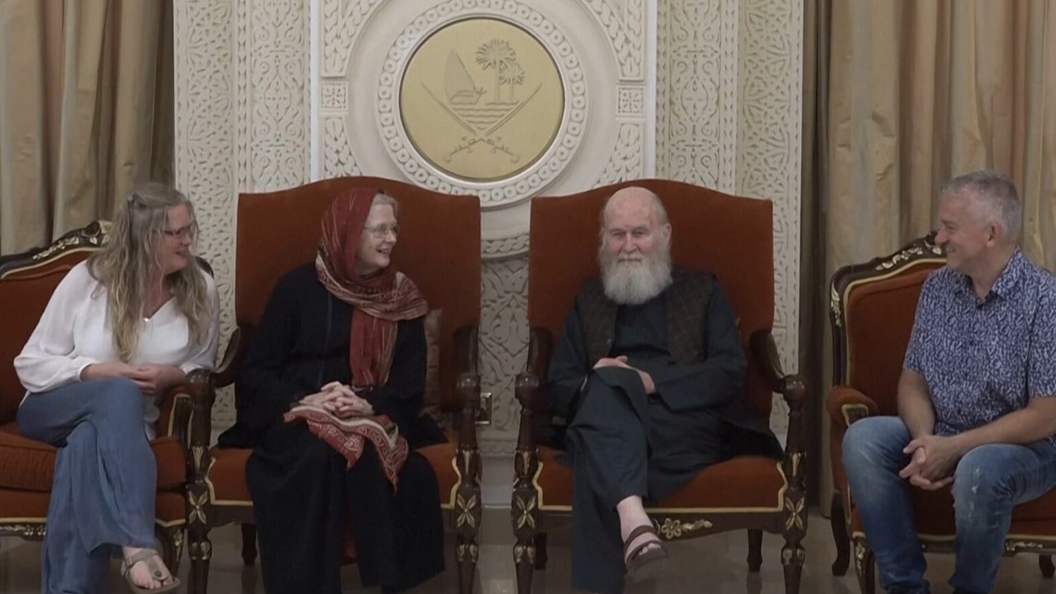 Peter and Barbie Reynolds seated with their daughter and others at the presidential hall at Doha old airport in Doha, Qatar, Friday, Sept. 19, 2025. 
