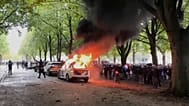 A police vehicle burns as a right-wing demonstration erupted into violence and chaos as rioters clashed with police on Saturday, Sept. 20, 2025 in The Hague, Netherlands.