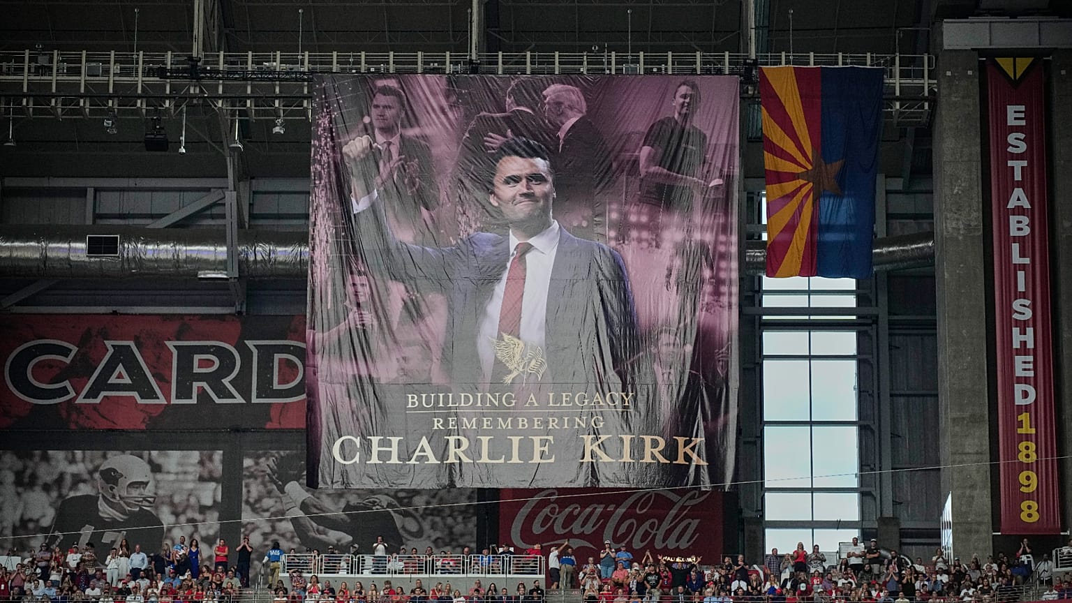A banner for conservative activist Charlie Kirk is seen during a memorial service at State Farm Stadium in Glendale, 21 September 2025
