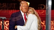 US President Donald Trump hugs Erika Kirk at the memorial of her husband, conservative activist Charlie Kirk, at State Farm Stadium in Glendale, 21 September 2025