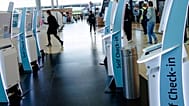 Check-in counters at a terminal at Berlin's Brandenburg airport, in Schönefeld, Germany.