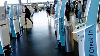 Check-in counters at a terminal at Berlin's Brandenburg airport, in Schönefeld, Germany.