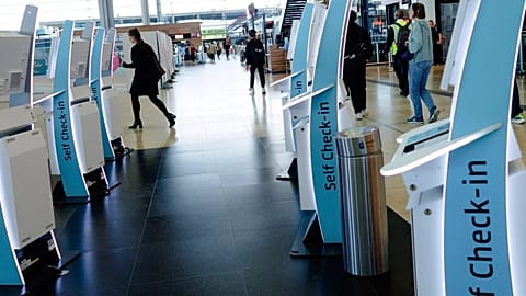 Check-in counters at a terminal at Berlin's Brandenburg airport, in Schönefeld, Germany.