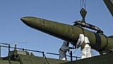 Russian troops load an Iskander missile during a tactical nuclear weapon drill at an undisclosed location in Russia, 21 May, 2024