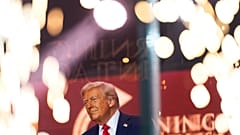 US President Donald Trump walks on stage to speak at a memorial for conservative activist Charlie Kirk, Sept. 21, 2025, (AP Photo)