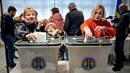 Women cast their vote during a presidential election and a referendum on EU membership in Chișinău, 20 October, 2024