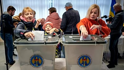 Women cast their vote during a presidential election and a referendum on EU membership in Chișinău, 20 October, 2024