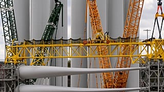 FILE - Wind turbine components sit at New London State Pier, 16 April 2025, in New London, Conn. 