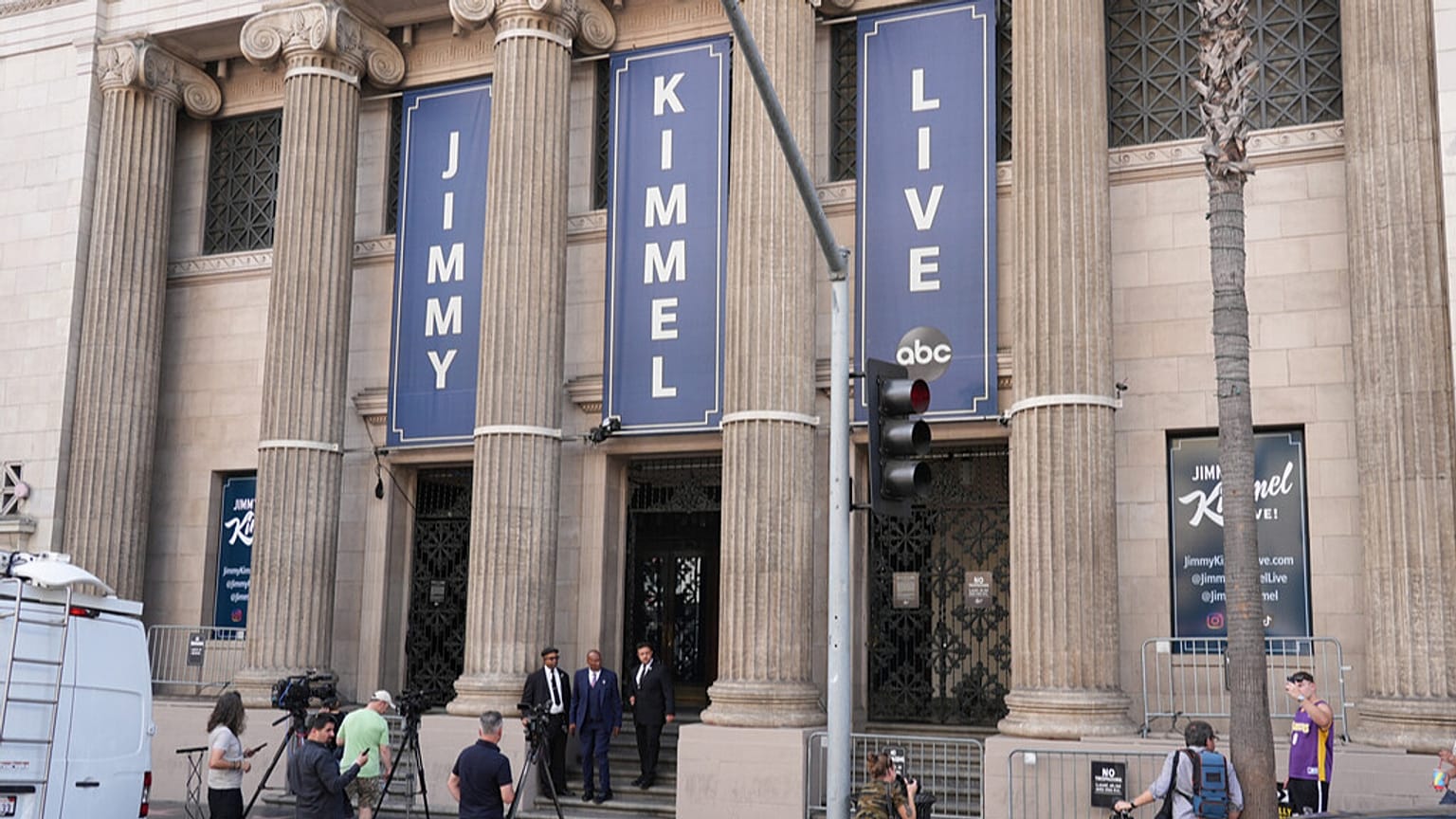 Media and pedestrians gather in in front of the Jimmy Kimmel Live studio on Hollywood Blvd., on Tuesday, Sept. 23, 2025, in Los Angeles.