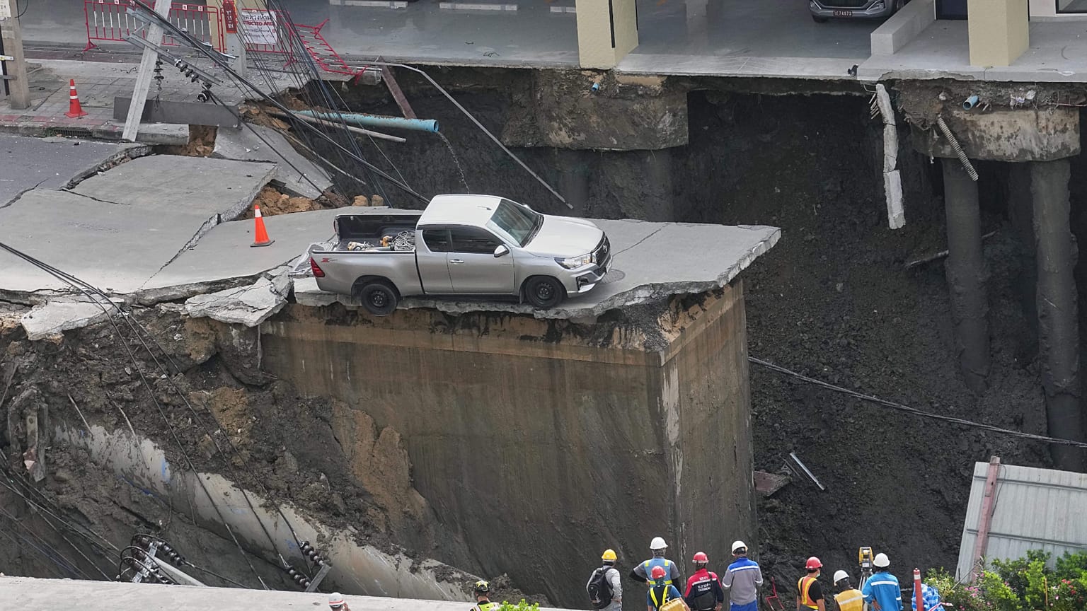 Damage is seen after a road collapse near Vajira Hospital in Bangkok.