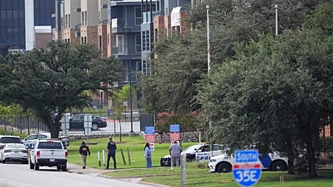 Police gather near an apartment building close to a US Immigration and Customs Enforcement office in Dallas, 24 September, 2025